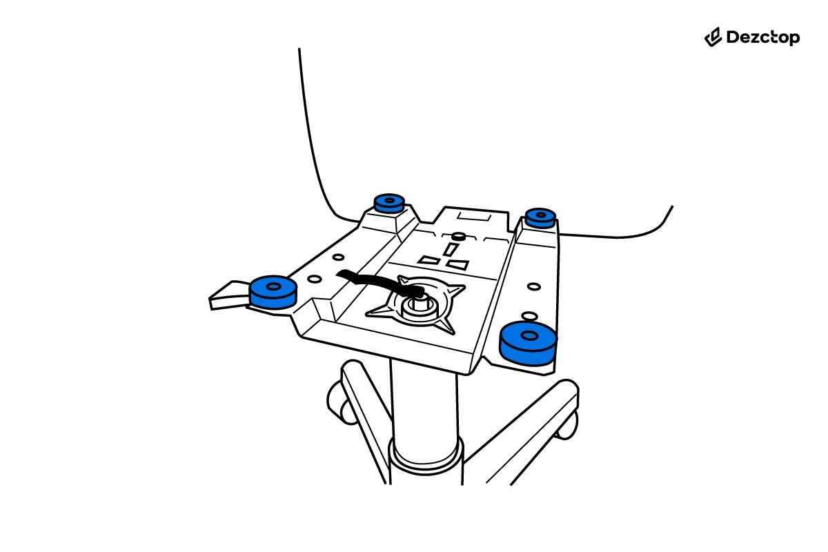 Underside of an office chair seat with blue spacers added around the mechanism mounting points.