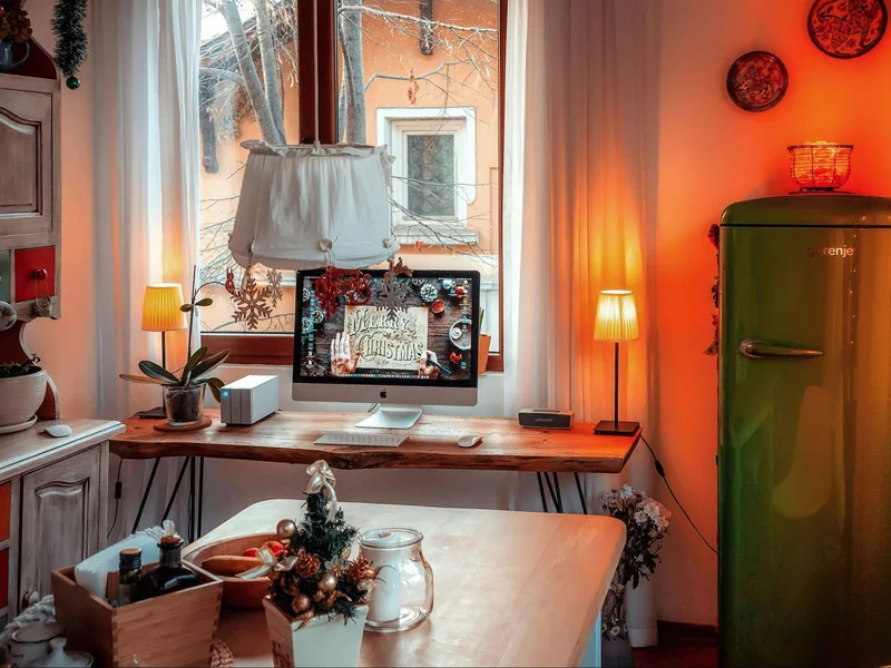 An image of a green refrigerator and homey desk lamps, part of a stylish home office setup.