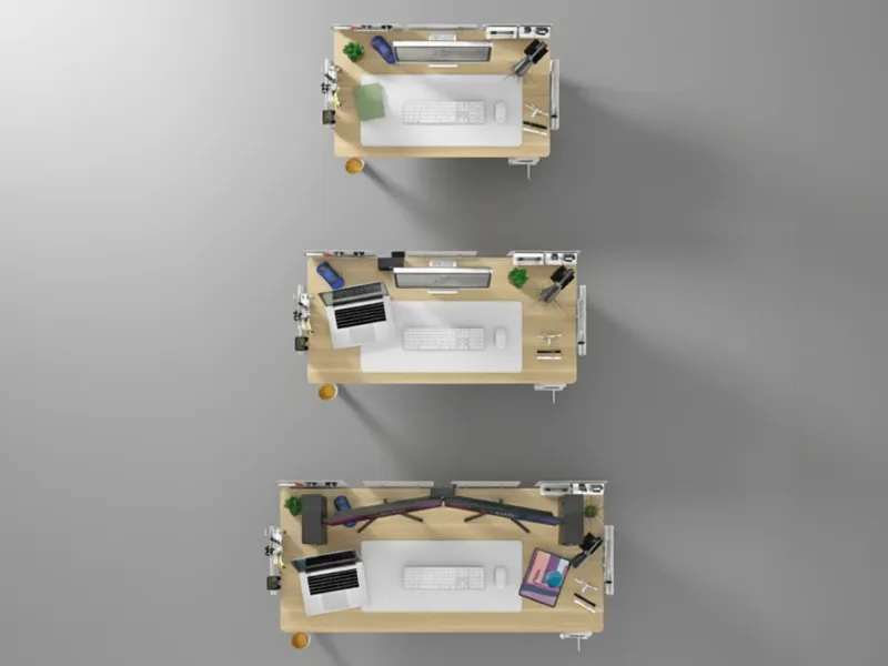 Top-down comparison of three standing desk setups in different sizes, each arranged with monitors, laptops, and workspace accessories.